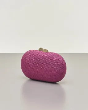 Clutch ovale fucsia con strass applicati all over e chiusura a scatto a sfera